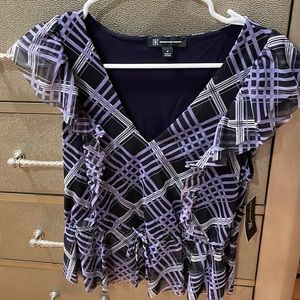 Brand new purple ruffle blouse. Never worn. New with tags.